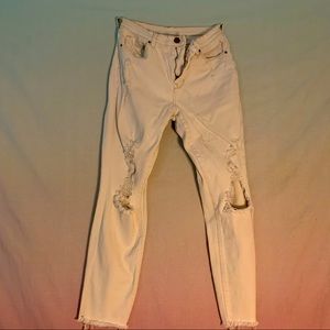 Stretchy high rise knee cut-out jeans